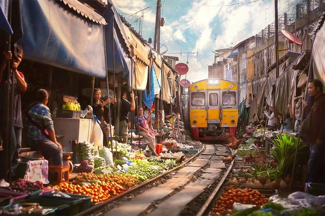 Amphawa Floating & Maeklong Railway Train Market (Small Group) - Wat Bang Kung: roots, shrines, and the 1800s soldier statues