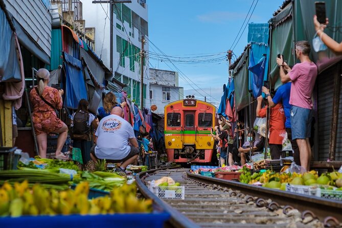 Amphawa Floating Market & Maeklong Railway Train Market Tour - Wat Bang Kung: Banyan-Root Temple That Feels Like a Nature Surprise