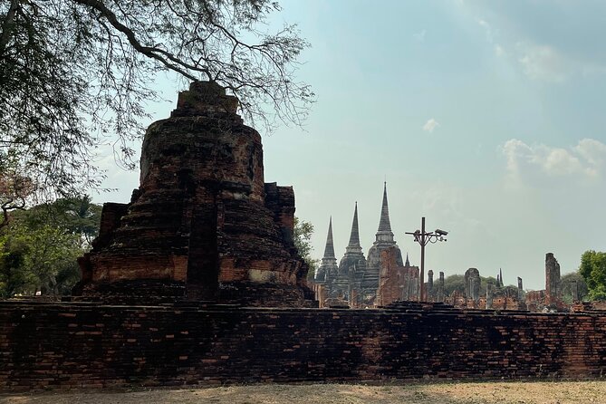 Ayutthaya Historical Old Capital day Tour from Bangkok - Wat Mahathat: Buddha head in tree roots and why it’s so iconic