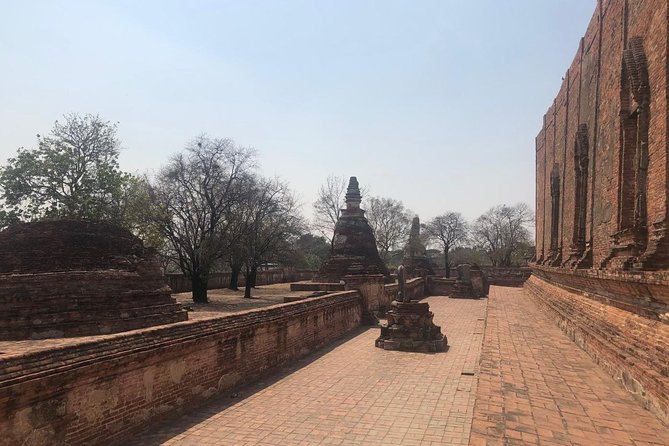 Ayutthaya One Day Tour go by Coach - back by River Cruise - Grand Pearl Cruise - The return ride includes a key Buddha stop: Phra Mongkhon Bophit