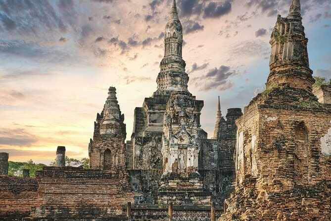Ayutthaya Sunset Boat Ride & Famous Attraction From Bangkok - Wat Yai Chai Mongkhon: Stupas, Shadows, and a First Taste of Ayutthaya