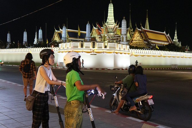 Bangkok at Night by Electric Scooter - Stop 1: Wat Arun shining after the river ferry
