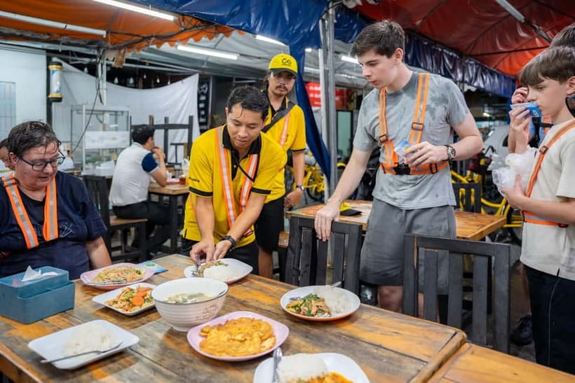 Bangkok by Night Cycling Tour with Street-food Meal - Chinatown after dark: lanterns, neon signs, and dinner energy