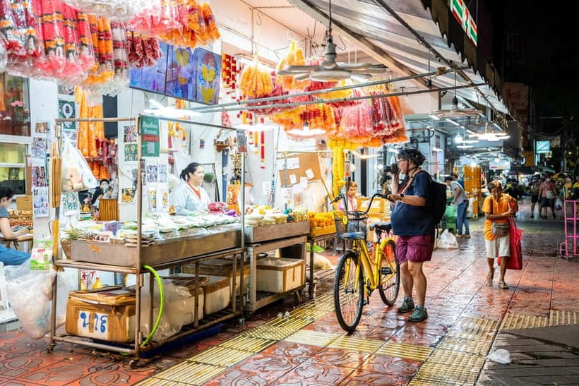 Bangkok by Night Cycling Tour with Street-food Meal - Bangkok’s flower market at night: blooms under colored light
