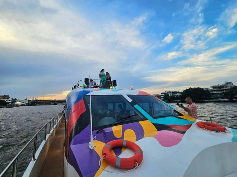 Bangkok: Chao Phraya Booze Cruise With Unlimited Drinks - Onboard vibe: music, snacks, life jackets, and those river-view windows