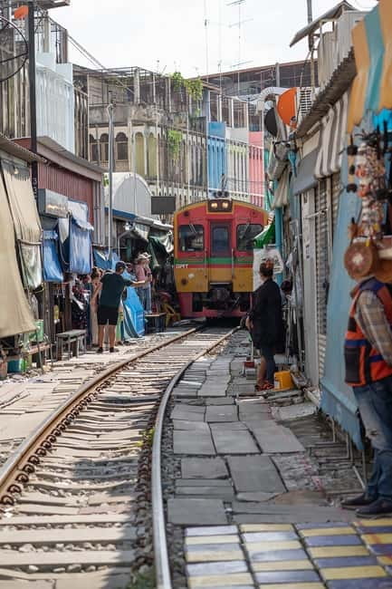 Bangkok: Floating Market, Phra Pathom Pagoda & Cafes Tour - Maeklong Railway Market: the fast-pack-up moment is the whole show