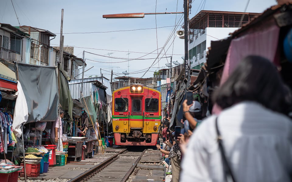 Bangkok: Maeklong Railway Market and Amphawa Floating Market - Maeklong Railway Market: watching the stalls vanish