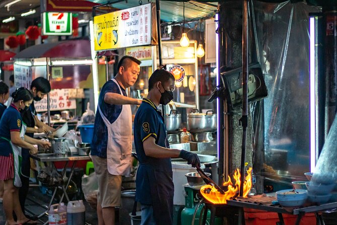 Bangkok Night Tour: Wat Arun, Wat Pho, Chinatown & Tuk Tuk Ride - Chao Phraya ferry to Wat Arun: porcelain and seashell details at night
