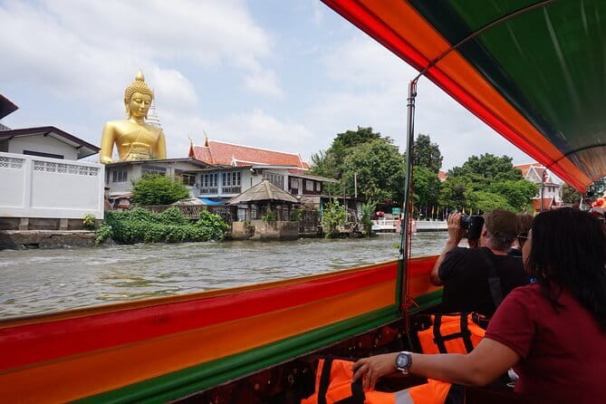 Bangkok Yai Local Canal Tour with Longtail Boat - Wat Paknam Phasi Charoen: the giant golden Buddha stop that anchors the trip