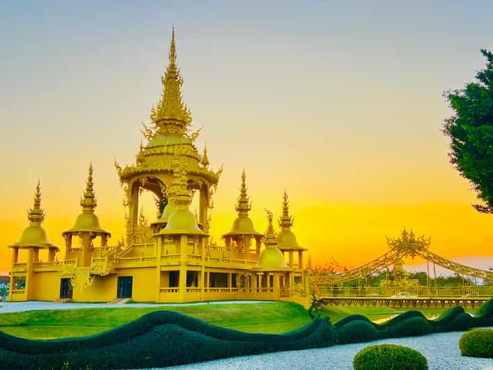 Chiang Rai: Discover 7 Must-See Spots & Lunch Included - Wat Rong Suea Ten: blue murals and a louder vibe