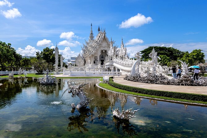 Chiang Rai Famed Temples and Golden Triangle Tour from Chiang Mai - Wat Rong Khun (White Temple): modern art, heavy crowds, big visuals