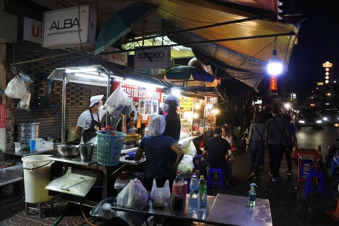 Chinatown Street Food Night Tour by Tuk Tuk in Bangkok - Wat Ratchanatdaram and the Grand Palace exterior: classic Bangkok glow