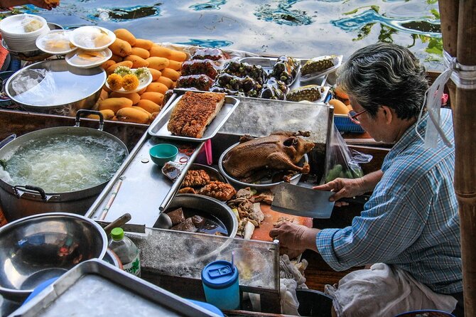 Damnoen Saduak Floating Market & Maeklong Railway Market Tour From Bangkok - Stop 1: Damnoen Saduak Floating Market on narrow khlongs