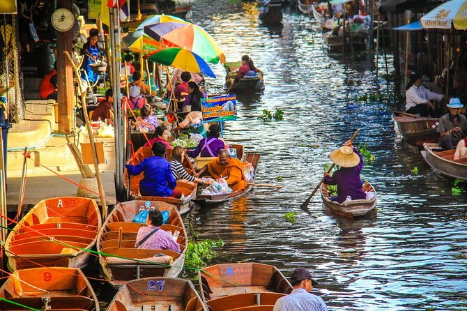 Damnoen Saduak Floating Market & Maeklong Railway Market Tour From Bangkok - Stop 2: Mae Klong Railway Market and the horn-and-hurry rhythm