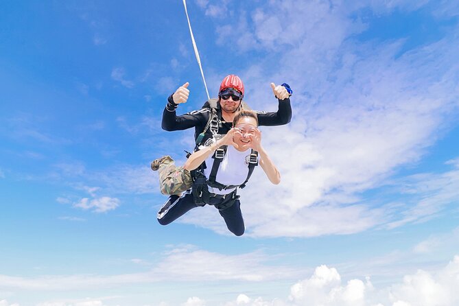 First Jump Tandem Skydive Pattaya Include Pickup Transfer - Parachute Ride and Grass Touchdown: What Happens After the Thrill