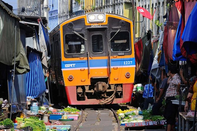 Floating Market Damnoen Saduak and Meklong Railway Market: Half Day Tour - Boat ride, snacks, and the small comforts that save your day