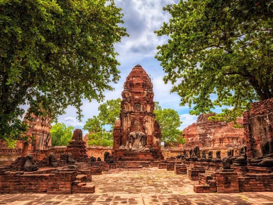 From Bangkok: Ayutthaya Temples and Boat Tour with Lunch - Wat Mahathat: the banyan-tree Buddha head and nature reclaiming history