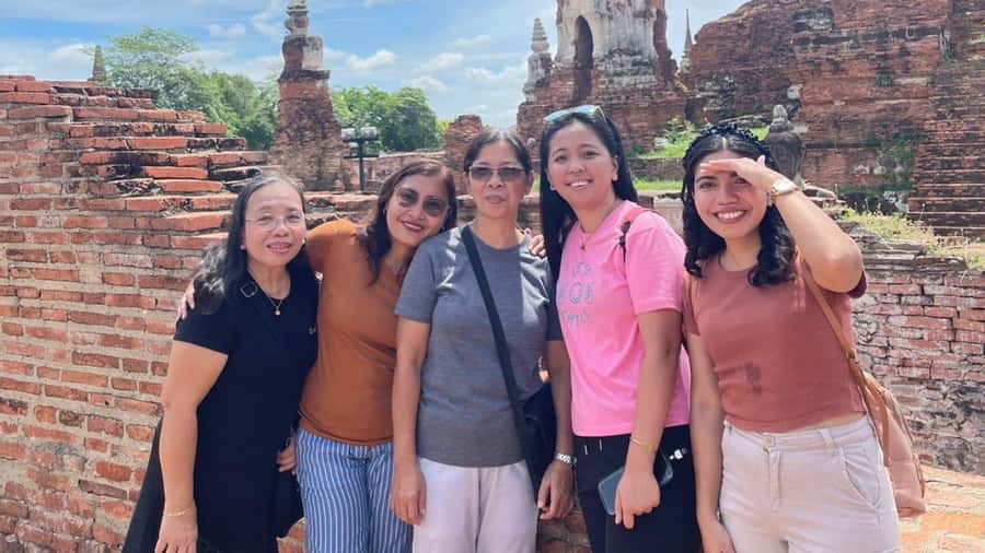 From Bangkok: Ayutthaya Temples Tour with Bang Pa-In Palace - Wat Yai Chaimongkol: murals, a reclining Buddha, and a clear storyline