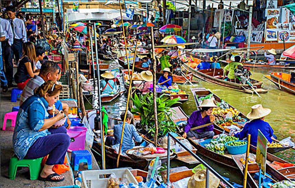 From Bangkok: Damnoen Saduak & Train Market Tour in Spanish - Damnoen Saduak Floating Market: 60 Minutes to Eat, Shop, and Snap Photos