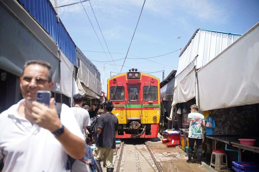 From Bangkok: Floating Market and Ayutthaya Guided Day Tour - Maeklong Railway Market: the part where the train owns the space