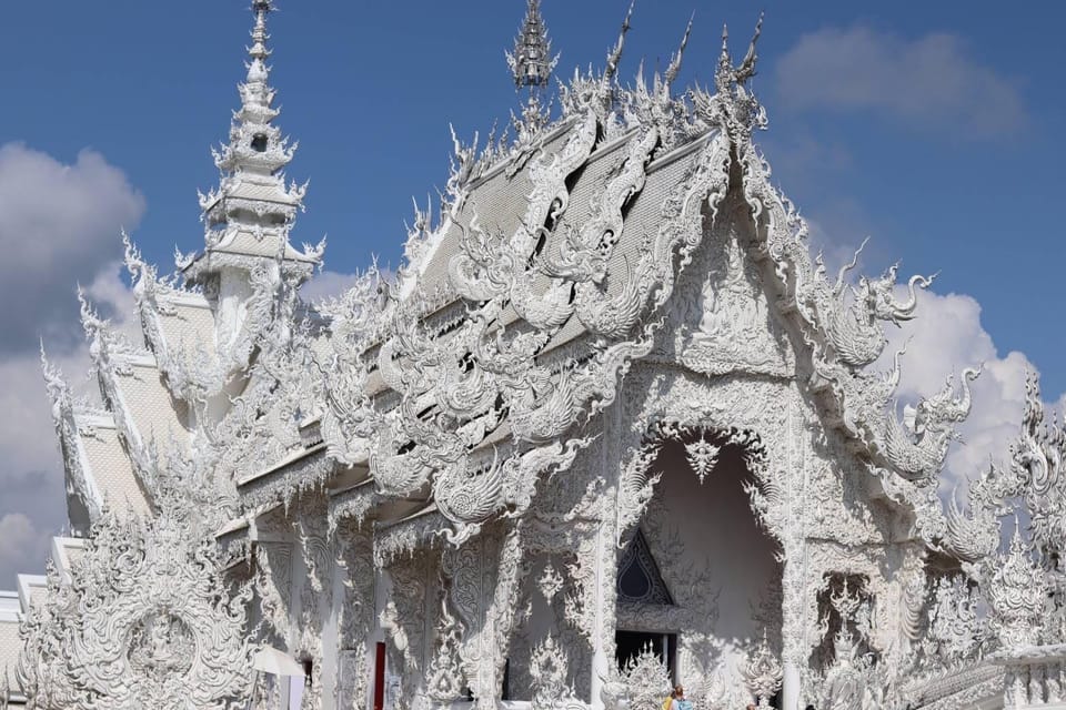 From Chiang Mai: Day Trip Chiang Rai White, Blue, Red Temple - Wat Huay Pla Kang (Red Temple): calmer pace with a mountain-top feel