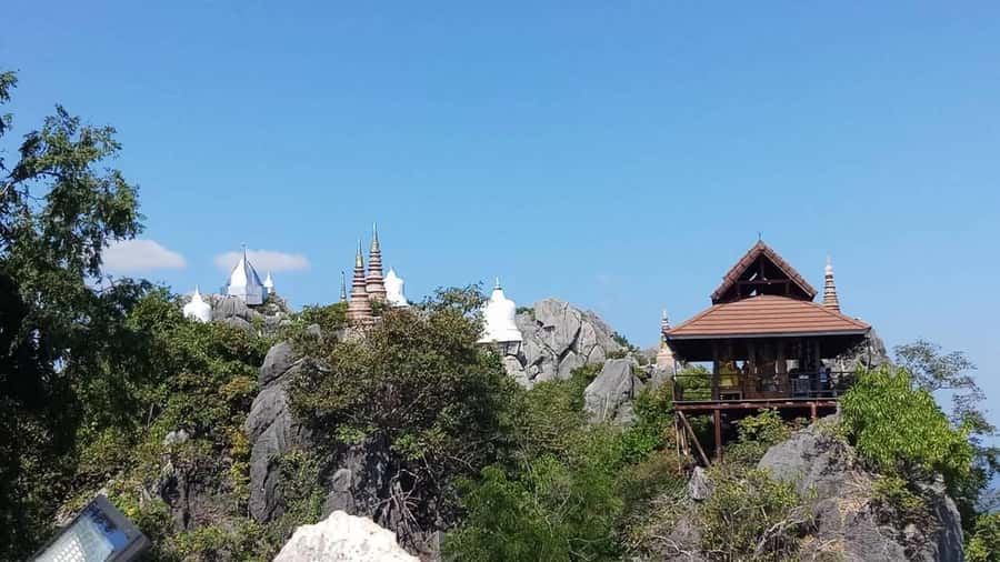 From Chiang Mai: Lampang Summit & Springs - The view payoff: pagodas on peaks and a camera-friendly moment