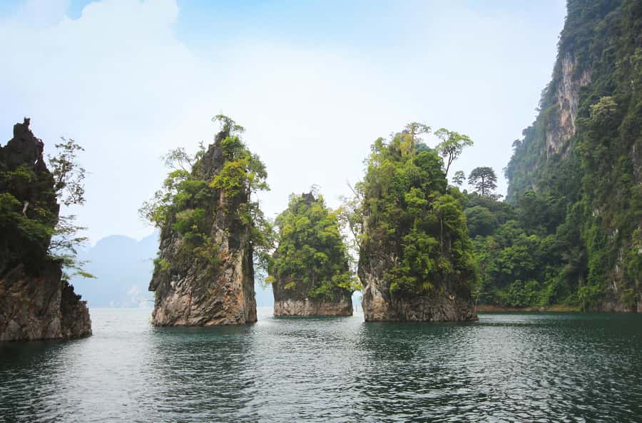 From Khao Lak/Khao Sok: Cheow Lan Lake and Emerald Pool Tour - Cheow Lan Lake by boat: Three Brothers Pillar and hidden lagoons