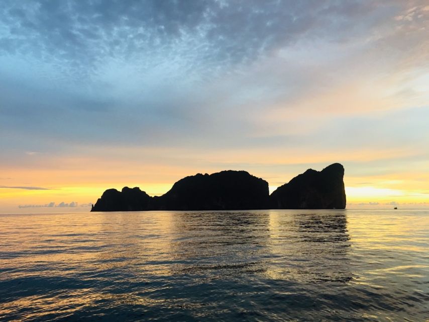 From Phi Phi: Private Full-Day Speed Boat Charter - Viking Cave and Pi Leh Lagoon: cave art and limestone-cliff color