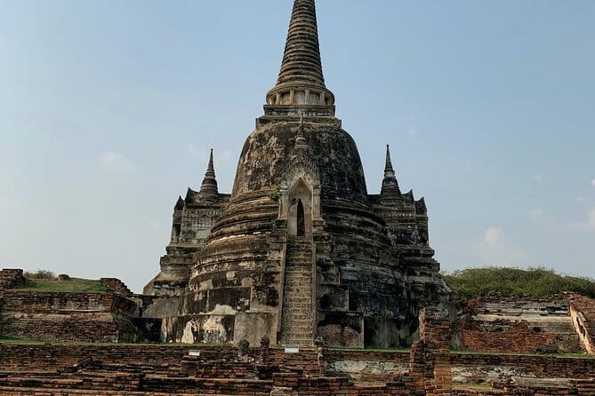 Glittering Ayutthaya Tour to Famous Sights, Market & Sunset Boat - Wat Mahathat: the tree-root Buddha head you came for