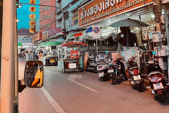 Guided Chiang Mai City Night Tour by EV Tram - The tram-to-market transition: Chang Puek Gate and street-food dinner planning