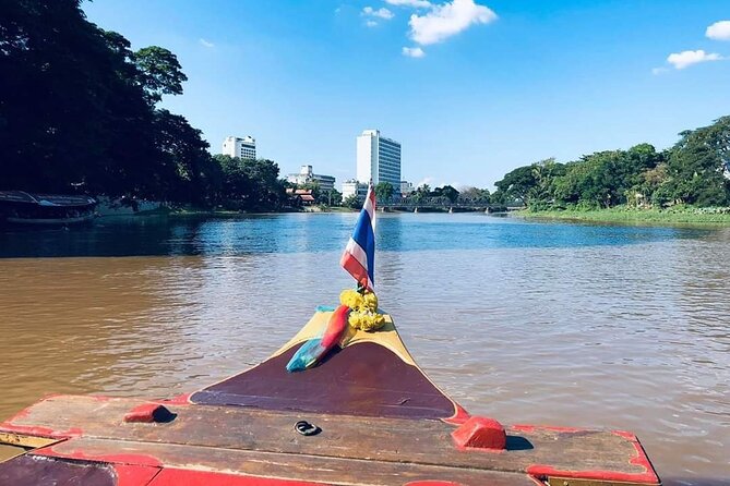 Half Day Private Chiang Mai Trishaw Ride and Mae Ping River Cruise - Wat Phra Singh Temple: ending at a major Chiang Mai spiritual landmark