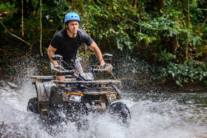 Highlight Khaolak ATV Quad-bike Adventure Experience - Off-road riding in real conditions: hills, puddles, and the guide’s choices