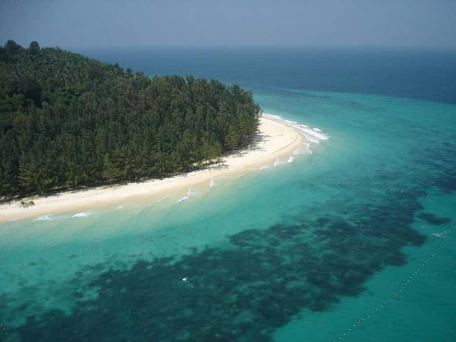 Ko Lanta: Early Bird the Emerald Caves and Koh Kradan Tour - Emerald Cave on Koh Muk: sunrise, a swim-through tunnel, and a lagoon view