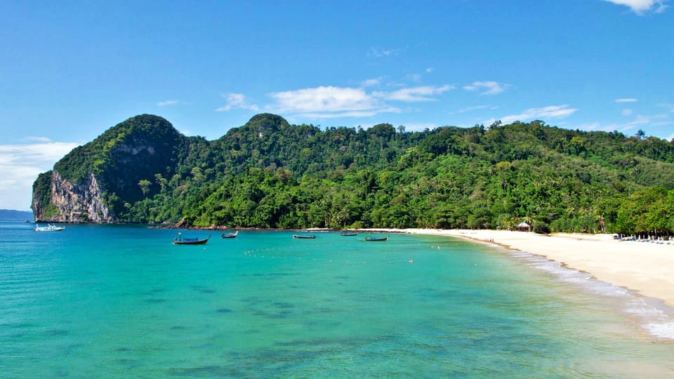 Ko Lanta: Emerald Cave and 4 Islands Tour by Longtail Boat - Koh Mook lagoon: cliffs, calm water, and a breather