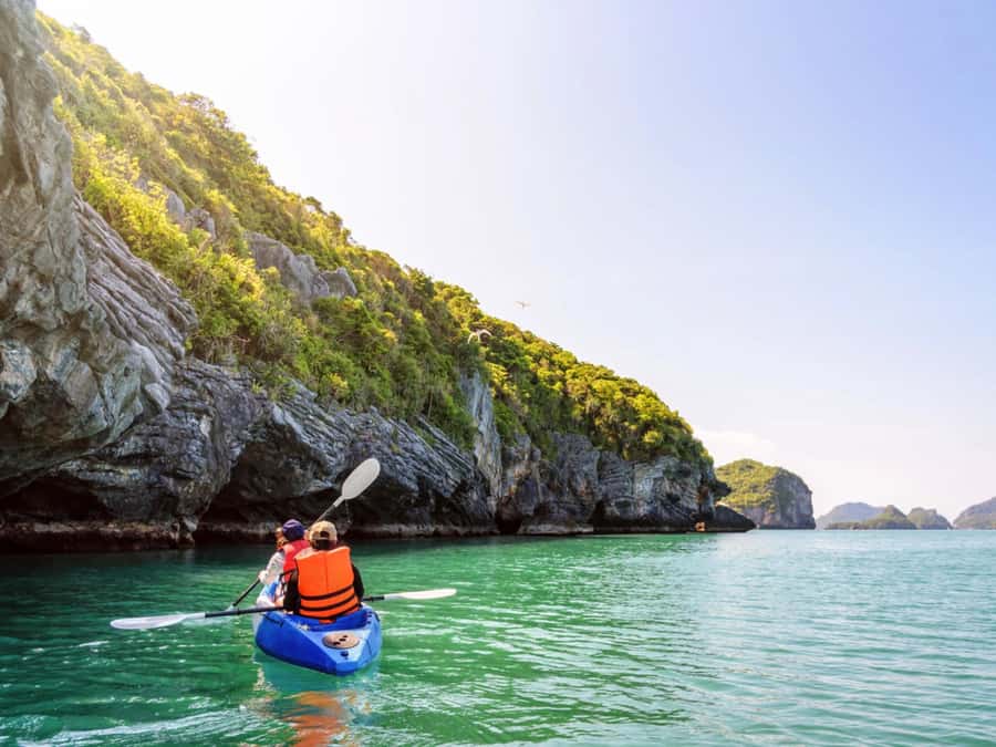 Ko Lanta: Private Sunset Long-Tail Boat Adventure Tour - Koh Talabeng by kayak: cliffs, caves, and plenty of water time