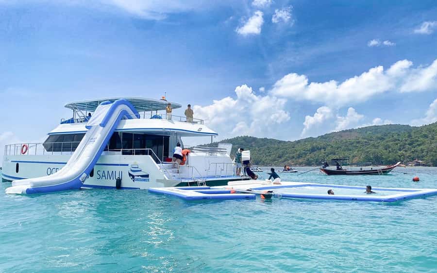 Koh Samui: Koh Tan and Koh Madsum Half-Day Tour by Catamaran - Koh Madsum / Pig Island: feeding pigs, quick beach time, and photo moments