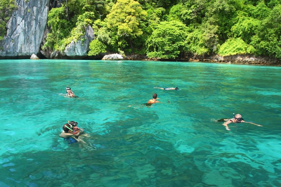 Krabi: Phi Phi Island Sunset Maya Bay and Four Islands Tour - Viking Cave and Pileh Lagoon: wildlife-style caves and a fish-tank swim