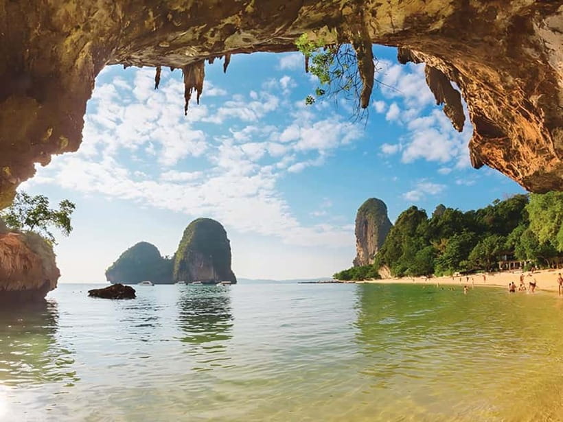 Krabi: Railay Phra Nang & Diamond Cave Sunset Plankton Tour - Phra Nang Cave beach time: shrine views, monkeys, and a rock-climbing scene