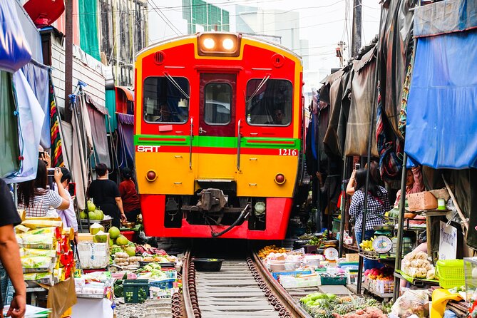 Maeklong Railway Market and Damnoen Saduak Floating Market Tour From Bangkok - Damnoen Saduak Floating Market: what the boat ride adds