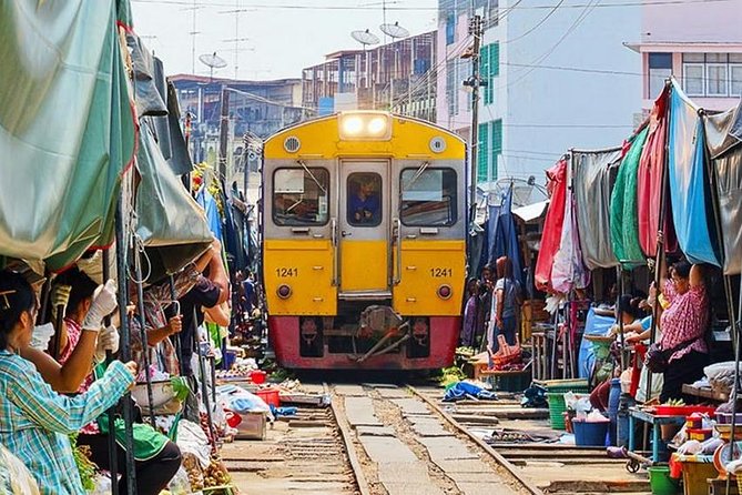 Maeklong Railway Market and Floating Market Tour from Bangkok - Damnoen Saduak Floating Market: a long-tail boat adds the real view