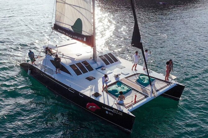 OMBRE Yacht Cruise to Racha & Coral Islands - Racha Island water time: snorkeling gear, paddle boards, and sea-flyer