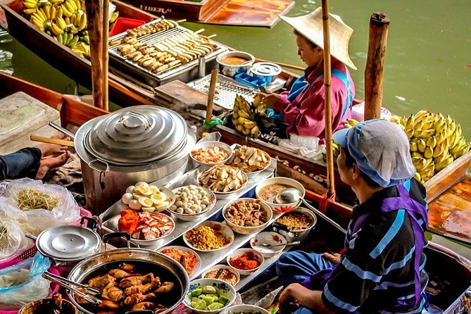 One Day Bangkok Everything - Mae Klong Railway Market: watching the train and the market adapt
