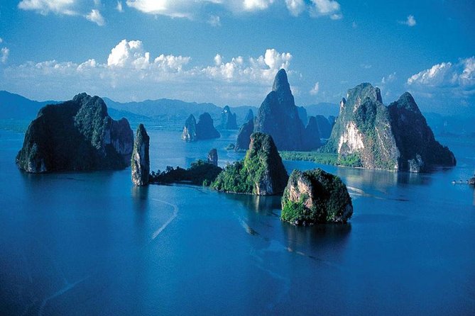 Phang Nga National Park Sea Kayak Adventure - Gliding in a 3-person inflatable canoe with a personal boatman