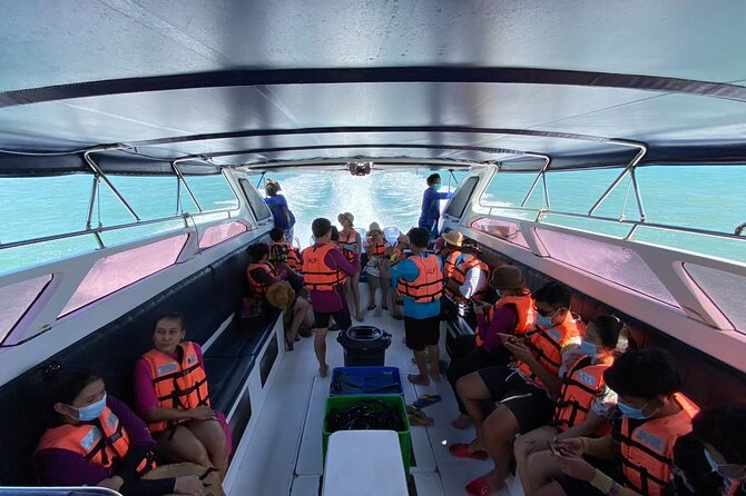 Phi Phi Island Hopping Day Trip by Speed Boat from Phuket - Pi Leh Bay: 100-meter cliffs and shade that helps