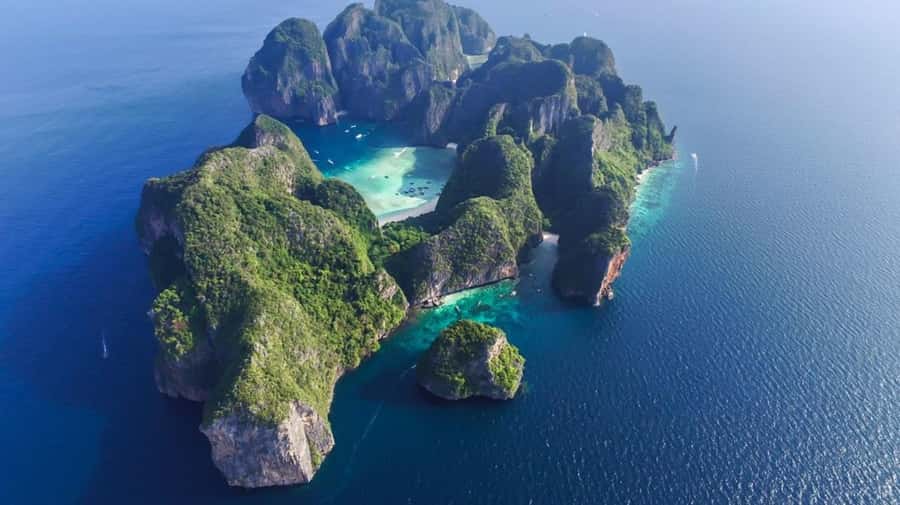 Phi Phi Islands: 2 Days, 1 Night Trip with Activities - Phuket to Phi Phi: Pickup, Pier, and the Speedboat Pace