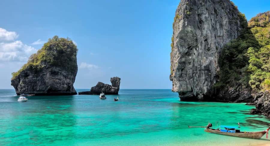 Phi Phi: Sunrise & Beat The Crowds to Maya Bay by Speedboat - Viking Cave from the boat: birds’ nests without getting inside