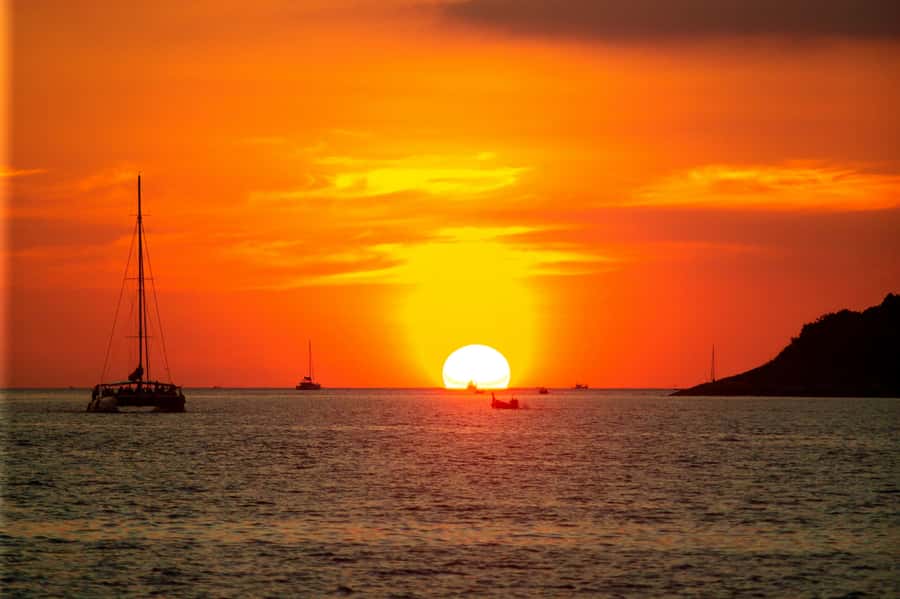 Phuket: Coral Island Day Trip and Sunset Dinner by Catamaran - From Phuket pickup to Chalong Pier: the smooth start