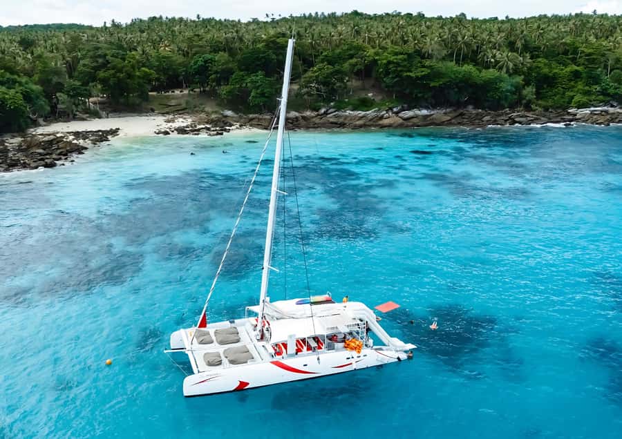 Phuket: Coral, Racha, Promthep Island Catamaran Trip & Lunch - Coral Island Stop: Swim Break, Beach Time, and Quick Recovery