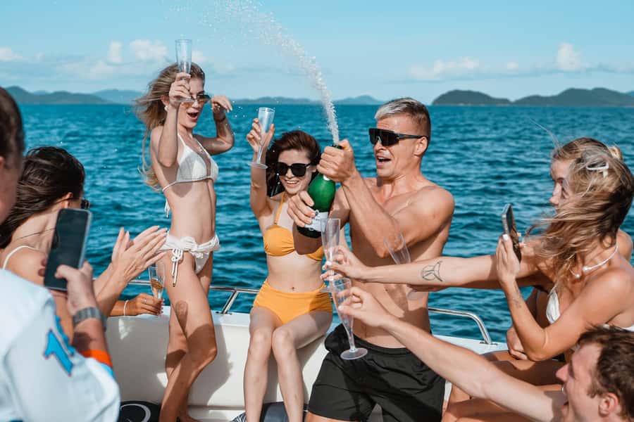 Phuket: James Bond & Phang Nga Bay by Luxury Sunset Yacht - Naka Island beach break: slide, glass-bottom views, SUP, and the snorkel check