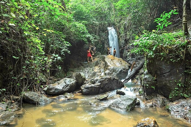 Phuket Jungle Trekking Experience at Khao Phra Taew National Park - Cooling Down at the Waterfall: Jungle Shower Time